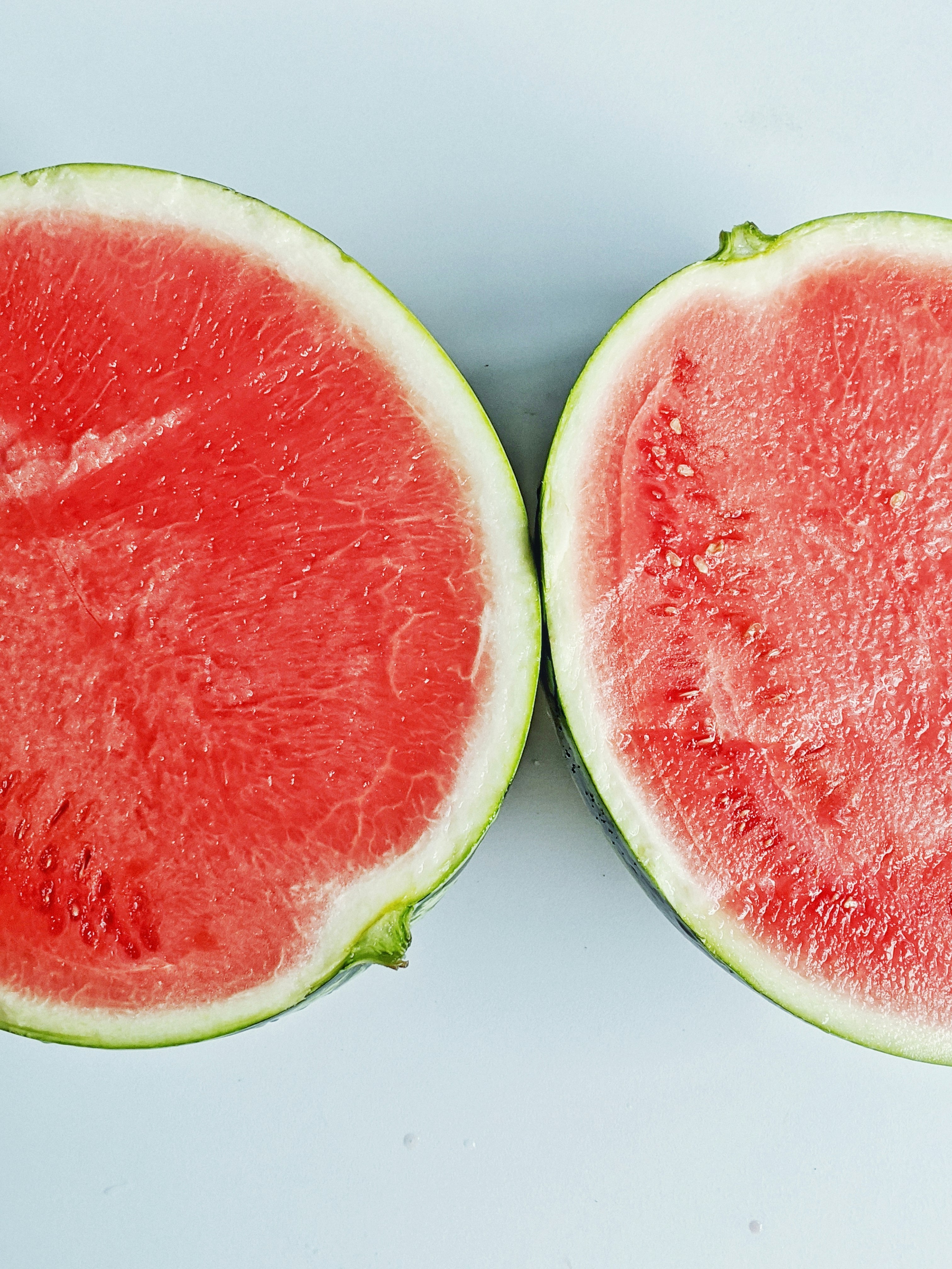 sliced watermelon on white table